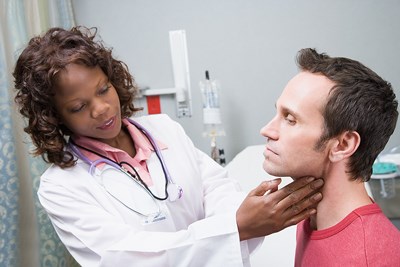 Image of a patient being checked for throat cancer